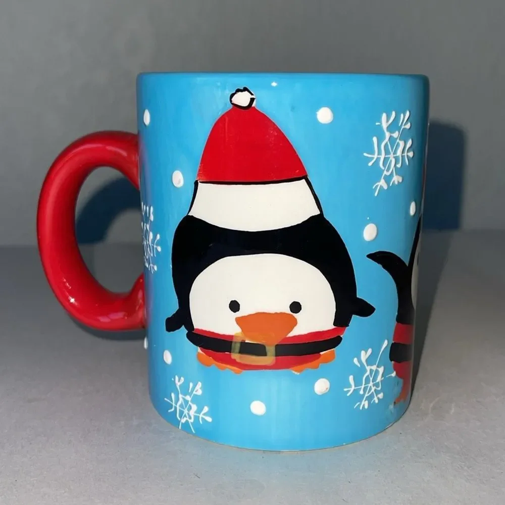 Pier 1 Penguin in Santa Outfit Blue Coffee Mug.